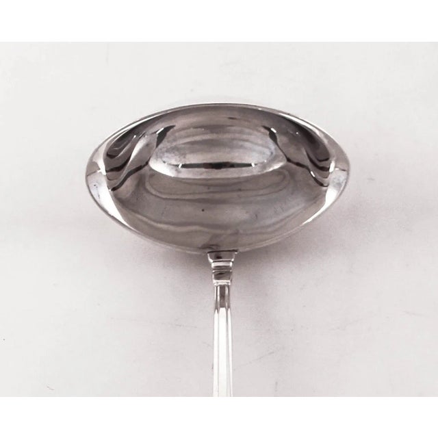 Being offered is a sterling silver gravy ladle in the “Sovereign” pattern by Gorham Silver. It has a great Art Deco look...
