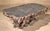 Large teak wood root coffee table. Over five feet long, this heavy table can be used inside or in your garden. Please...