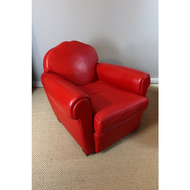 Pair of red leather club chairs with removable cushions, in excellent condition, and very comfortable seats. DIMENSIONS:...