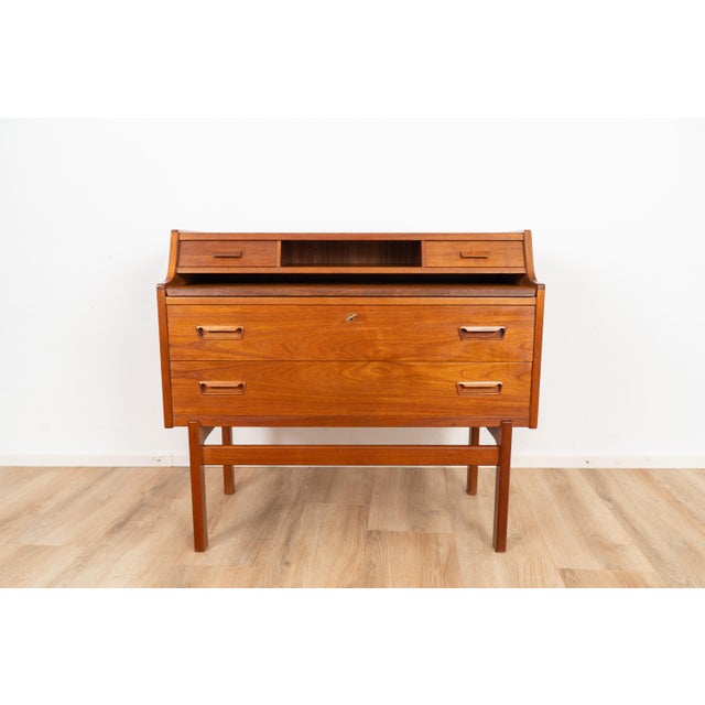 Writing desk by Arne Wahl Iversen Vinde Møbelfabrik. The desk is made out of wood and comes with multiple storage...