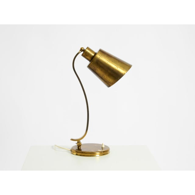 Beautiful, large, heavy mid-century modern table lamp made of brass. Made in the early 1950s. Very elegant, high-quality...