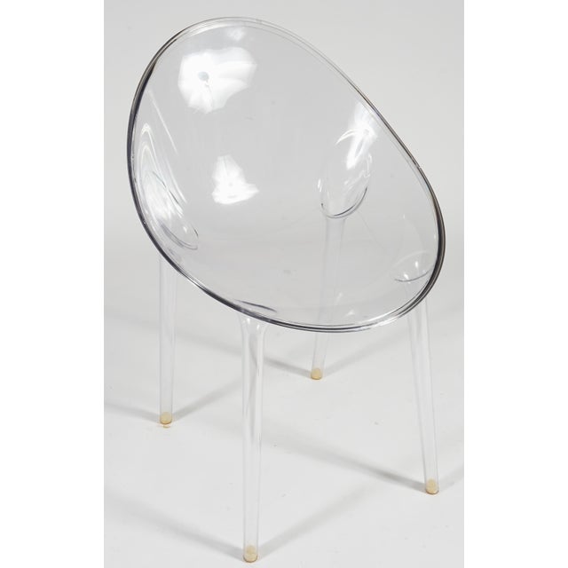 This is a Kartell Mr. Impossible dining chair designed by Philippe Starck, featuring a transparent seat and legs. Sleek-...