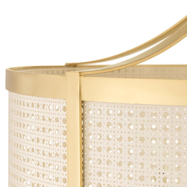 The Ethan Chandelier blends industrial texture with contemporary form. A woven mesh shade softens the light, creating a...