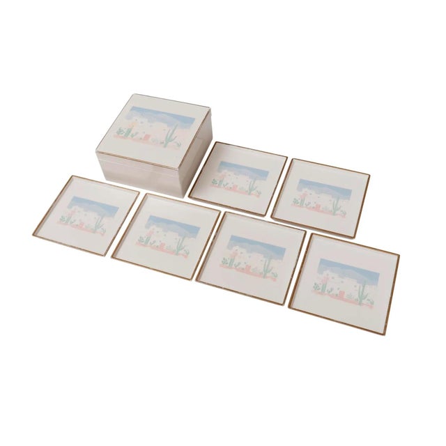 A set of six square lacquerware coasters with matching case by Otagiri of Japan. A southwestern scene is centered on the...