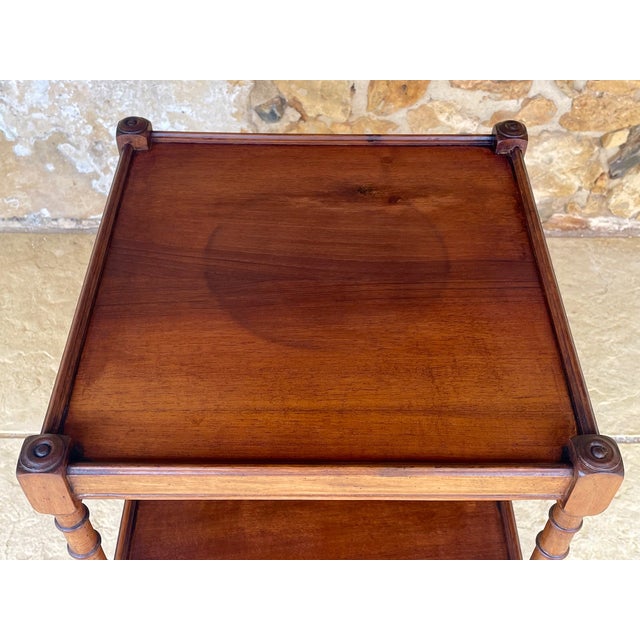 Vintage, three-tiered side table, console table made of walnut, from the 1920's - 1930's. The structure is made of walnut...