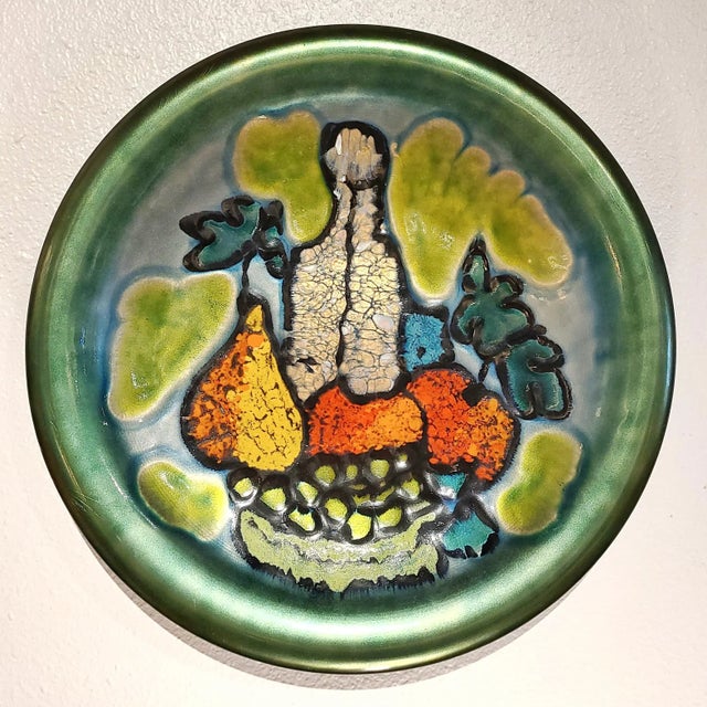 A large and beautiful wall plate of enamelled copper designed by Ubaldo Cinciraini for Studio Cellini Rame d'Arte Pesaro,...