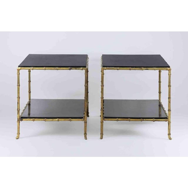 Pair of brass and wood coffee tables, realized in Italy in the mid-20th Century. Very good condition.