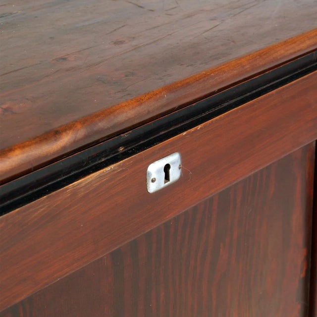 This mid-century large container box trunk for furs is made of solid pine wood polished to wax.