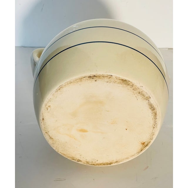Beautiful antique cream ceramic jinger jar with handles and cover.