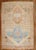 A room-size geometric Turkish kars rug from the 3rd quarter of the 20th century with 2 large brown medallions on a khaki...