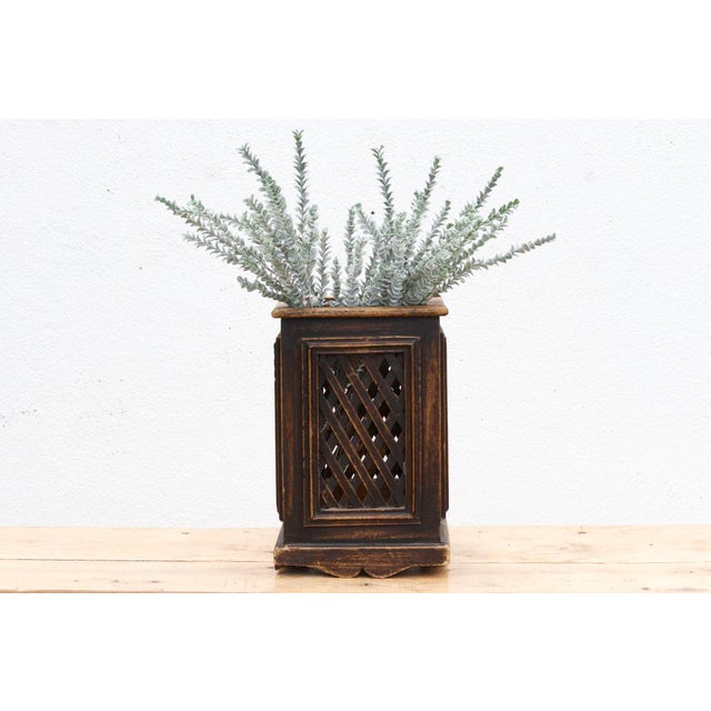 This vintage carved wooden planter or decorative container, measuring 9 inches square at the base and 14 inches high, is a...