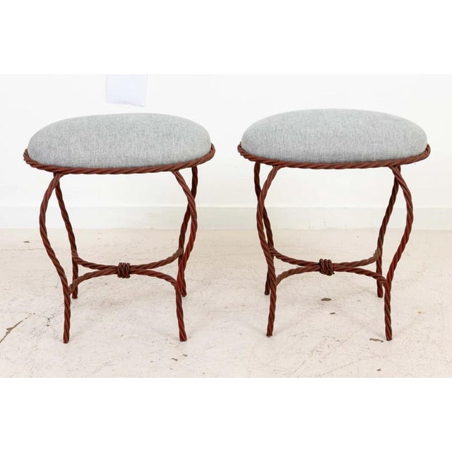 Pair of Oval Italian iron rope benches with upholstered tops. Bases in good condition, with newly upholstered tops. In...