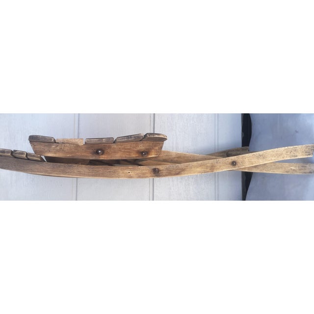 A unique wooden folding chair made of solid wood. The main structure features a slatted seat. The chair has a beautiful...