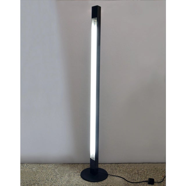 Neon floor lamp model 'Rio' design Rodolfo Bonetto for Luci, 1980s. Metal base, triangular aluminum stem with neon and...