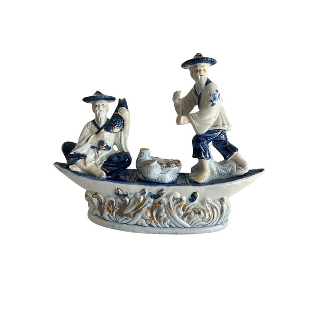 Delve into the timeless beauty of Chinese craftsmanship with this vintage blue and white porcelain figurine depicting a...