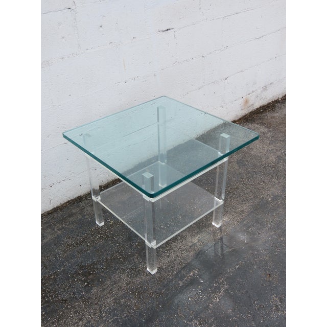 This classic Two Tiers Side Table is made of Lucite and glass. This Side Table has Hollywood Regency design, the Lucite...
