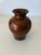 A delightful vintage ceramic vase featuring a raised, hand-glazed butterfly motif in rich earthy tones. The dimensional...