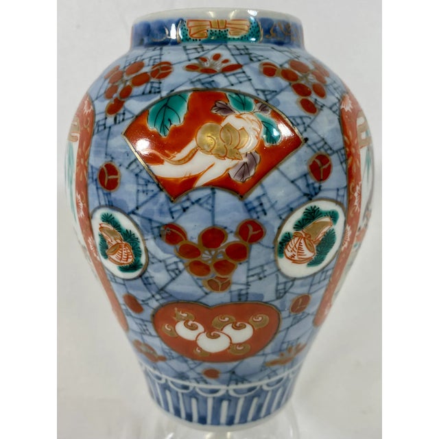 Small Antique Imari Vase From Japan - Circa 1900 Very curious & beautiful little vase depicting a flute player riding a...