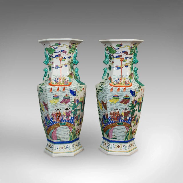 This is a very large pair of antique decorative vases. An Oriental, ceramic baluster urn or stick stand, dating to the...