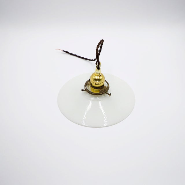 We offer this Milk Glass Vintage Industrial Pendant Light. Glass shade in excellent condition. The electrical system is...