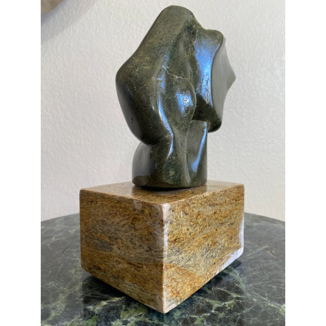 Green carved abstract sculpture signed and dated by artist. Exquisite veining and unique from all sides. Attached display...