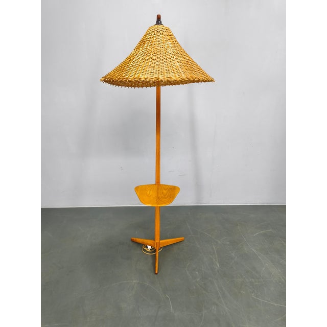 Mid-century floor lamp produced by Krkonošský nábytek in 1960s Czechoslovakia. This unique design features a solid maple...