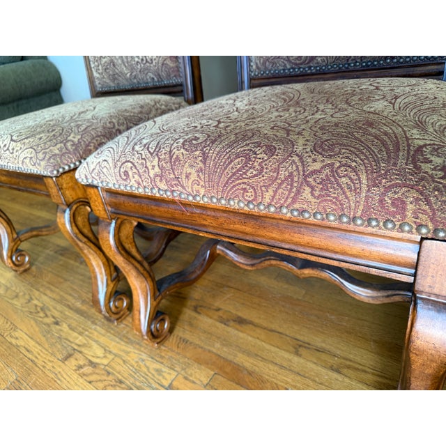 A pair of vintage Spanish Revival chairs (dining or just side) feature a richly stained wood frame w and classic stretcher...
