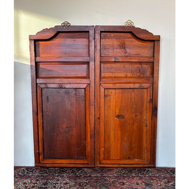 Intricate hand-carved set of antique Chinese doors. Each measures 35” high and 15.5” wide. Detailed frieze depicting a...