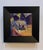 This oil on panel artwork presents a dynamic composition filled with abstract shapes and vibrant colors, suggesting a...