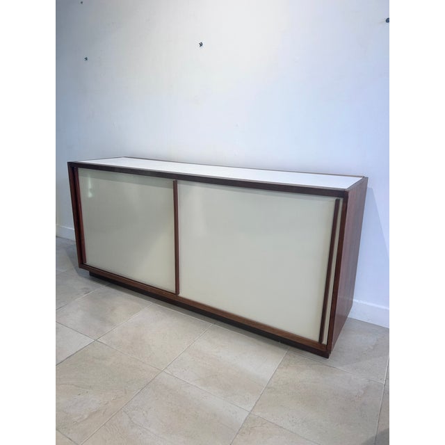 A double-sided sliding-door buffet. Mahogany frame with a white melamine finish. Designed by Le Corbusier for the "Cité...
