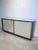 A double-sided sliding-door buffet. Mahogany frame with a white melamine finish. Designed by Le Corbusier for the "Cité...