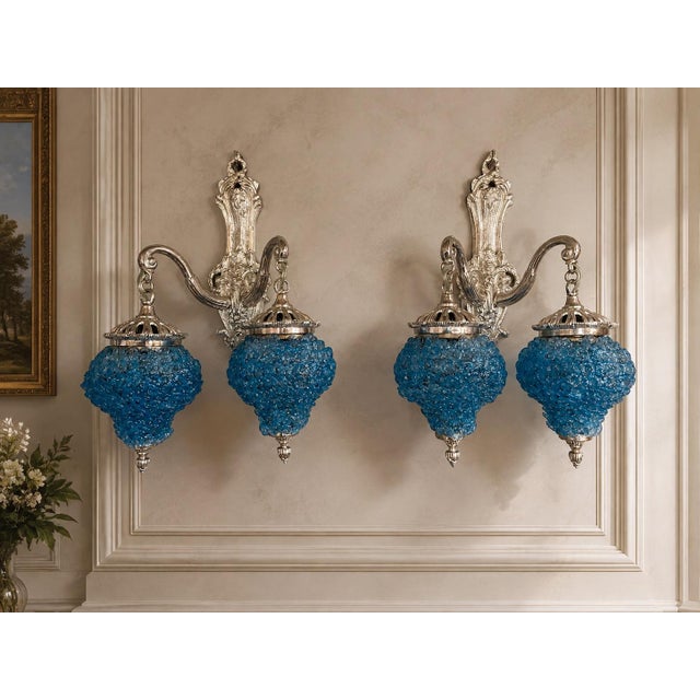 This striking pair of French wall sconces dates to the 1990s and combines elegant Louis XVI styling with a distinctive...