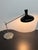 Design Plus Gallery presents a Cantilever Table Lamp with Black Adjusting Light Source. The lamp has a design that is...