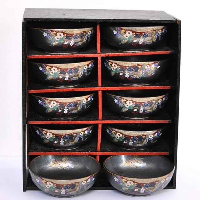 From Japan’s Showa period, this is an exceptionally beautiful polychrome Kagoshima-Black Satsuma condiment set, comprising...