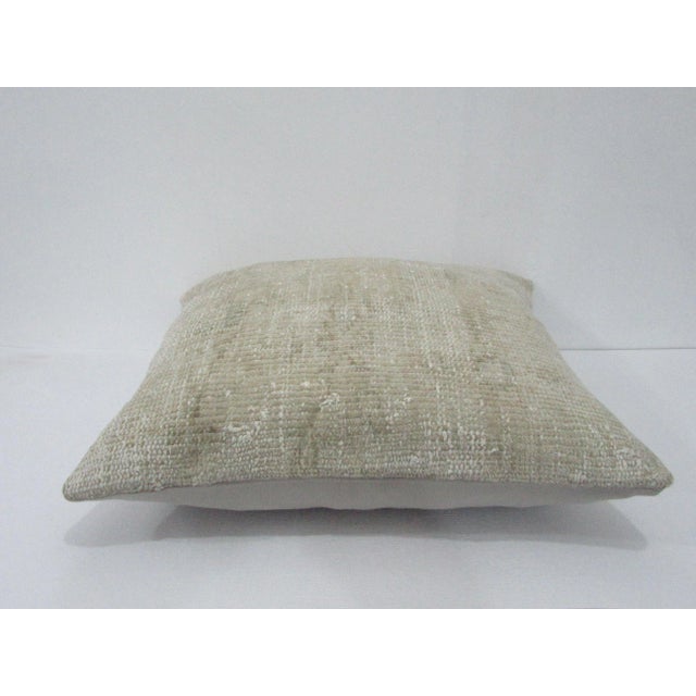 Decorative pillow cover made from a vintage Turkish handknotted rug. Backed with good quality cotton fabric. Pillow...