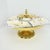 This vintage piece has been used as a divided relish and nut serving tray pairing china components with a polished, gold-...