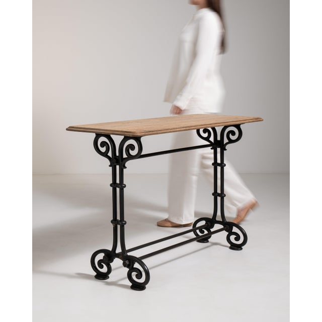 A classic French café table rooted in the culture of early 20th century Parisian bistros, where cast iron bases were used...