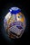 A flattened ovoid vase in cobalt blue overlay crystal on white, cut with geometric facets—medallions, radiating shuttles,...