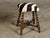 An English Turn of the Century barley twist stool from circa 1900 with zebra hide upholstery and X-Form cross stretcher....