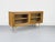 A high-quality display cabinet crafted from oiled oak with a warm, natural look. The two sliding doors feature solid wood...