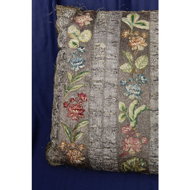 This is an antique French or Italian silk pillow. The piece dates back to the 19th century.
