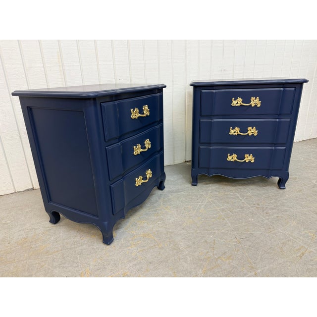 These elegant 1960s French Provincial three-drawer nightstands have been beautifully refinished in a rich navy blue,...