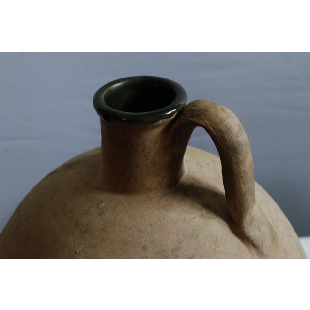 Terracotta amphorae pitcher produced by Vetus Siena in the early 1970s as part of their opening years. Forest green glazed...