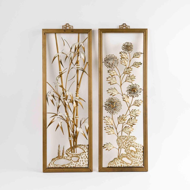Exquisite set of four vintage mid-century floral wall sculptures featuring delicate gold and off-white metal flowers...