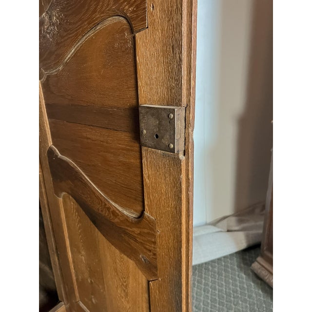 Standing over seven feet tall, this impressive French oak armoire embodies the craftsmanship and enduring character of...