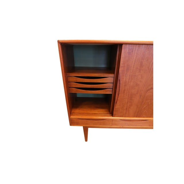 An incredibly beautiful and tasteful cabinet made with the utmost care! The cabinet is Danish and has long elegant lines...