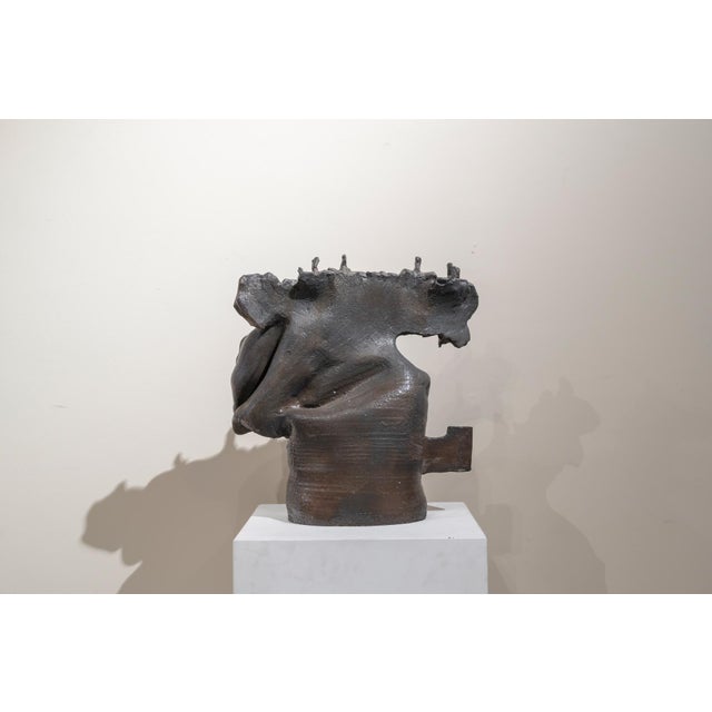 Unsigned ceramic piece from the second half of the 20th century, made in Spain. Gray-glazed terracotta with red highlights...