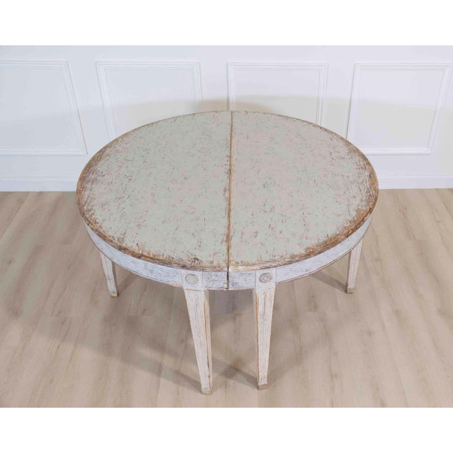 Made in Sweden around 1850, this large pair of Gustavian style demi-lune tables has been repainted in grey. The demi-lune,...
