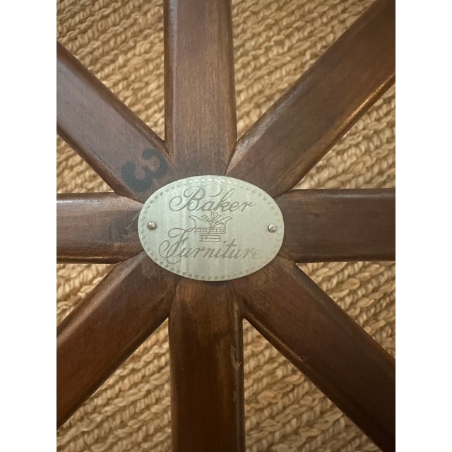 A striking example of Baker Furniture's celebrated mid-century craftsmanship, this exceptional coffee table combines...
