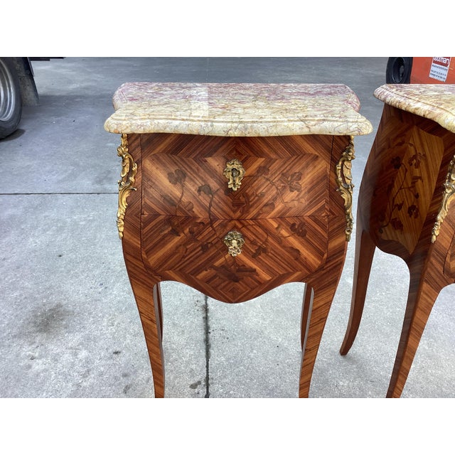 This is pure French elegance. This pair of French side table are made of satinwood and feature exquisite inlay work of...